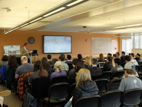 Events image featuring a panel of presenters and audience at a PLHC American West Program.